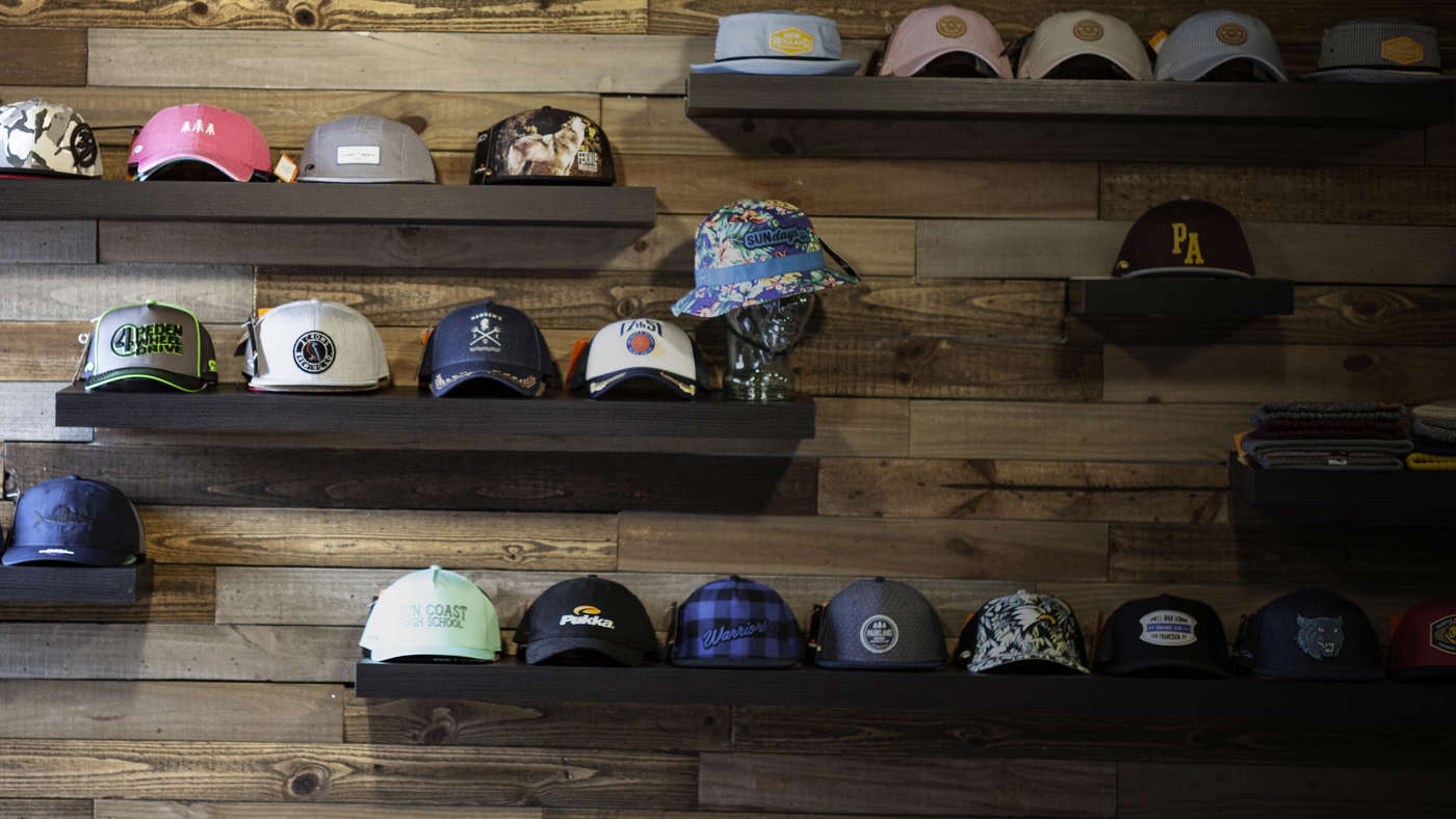 Wall of shelves with hats