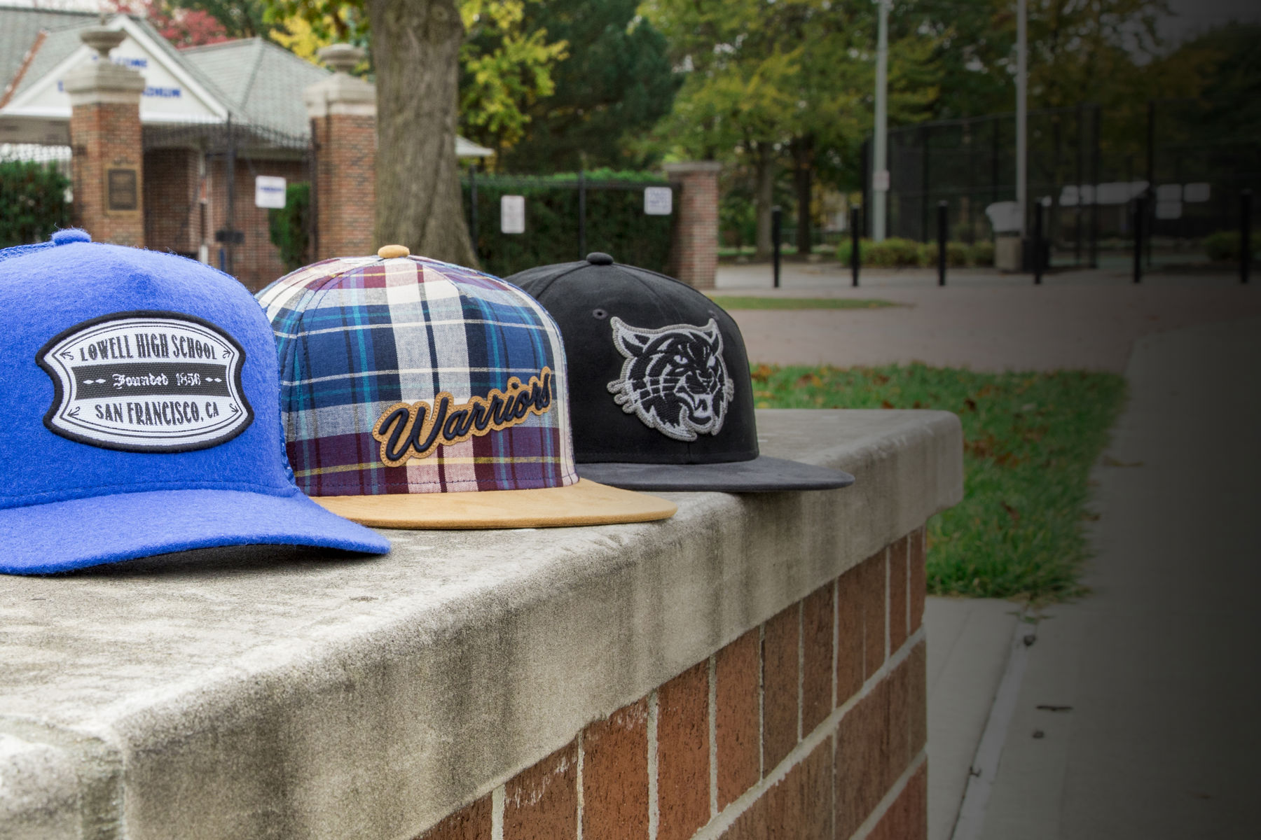 Spirit Wear hats sitting on running track
