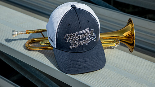 Team Sports Band hat next to a trumpet