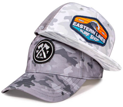 Stack of custom hats featuring new OptiCam TriTech color options