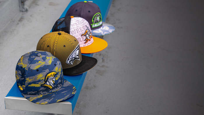 Pukka Hats lined up on a bench