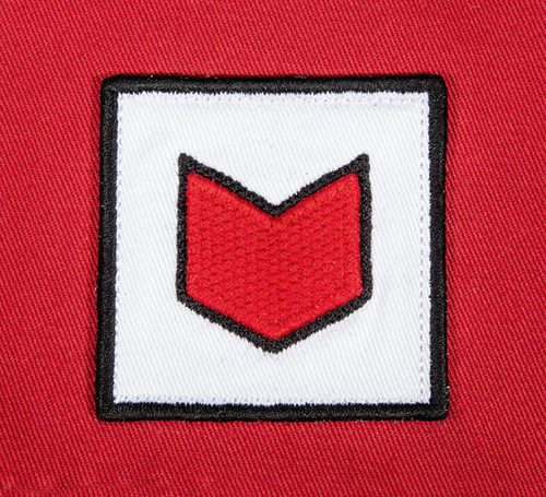 Pukka hat patch embellishment with raised and flat embroidery and textured pearl fill stitch