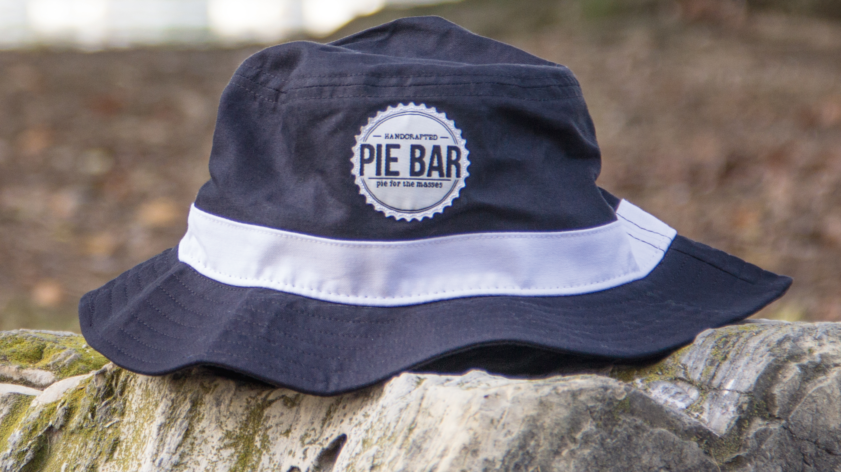 Bucket hat sitting on stone wall