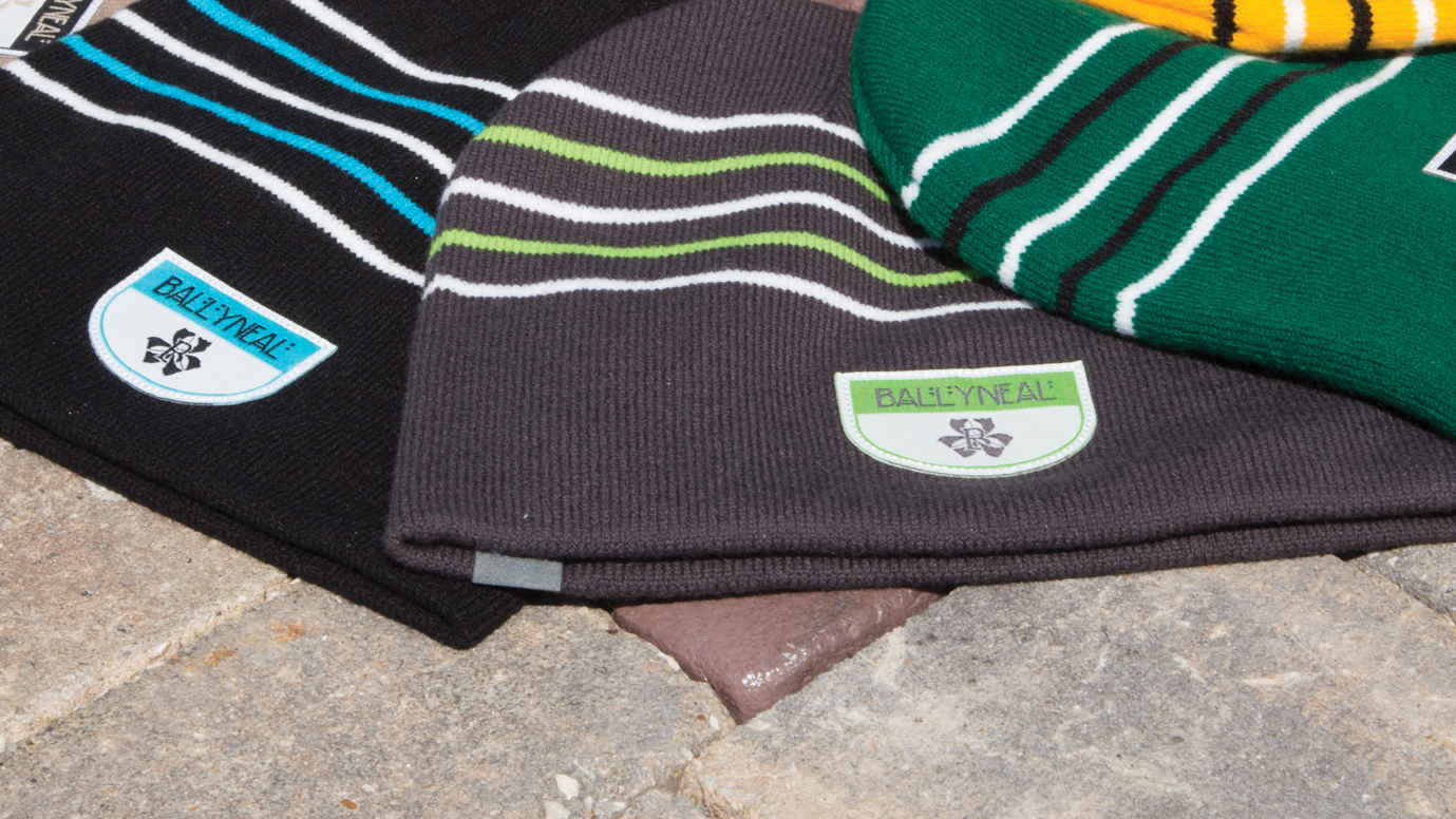 Cold Weather Knits laying on stone and brick