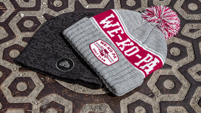 Vintage Knits laying on a manhole cover